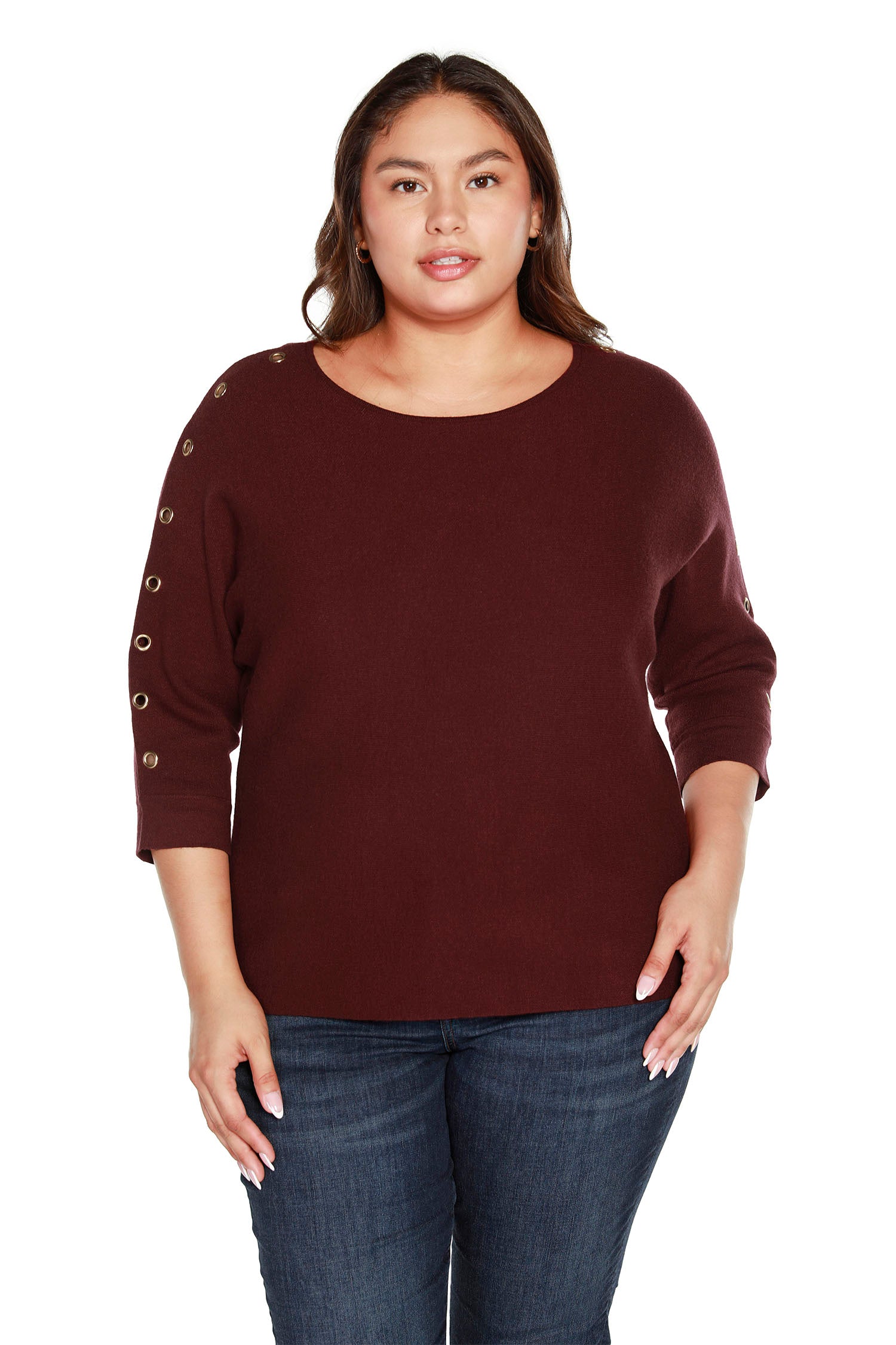 Crafted in a super soft knit fabric, this contemporary plus size dolman sweater is the perfect choice for any modern woman's wardrobe. Featuring a loose and comfortable fit with 3/4 sleeves and grommet trim, this sweater adds a modern touch to any look. 