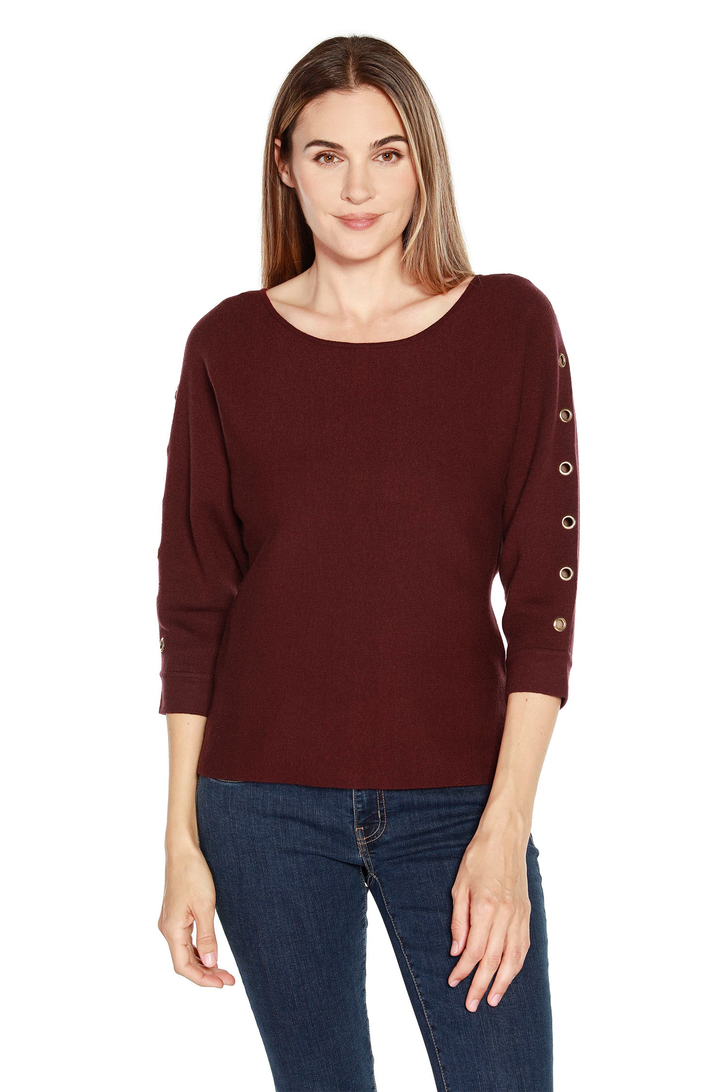 Crafted in a super soft knit fabric, this contemporary dolman sweater is the perfect choice for any modern woman's wardrobe. Featuring a loose and comfortable fit with 3/4 sleeves and grommet trim, this sweater adds a modern touch to any look. 